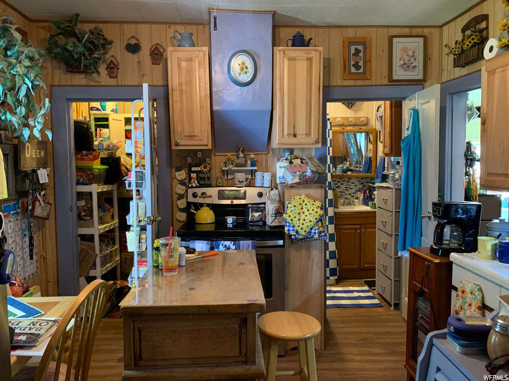 Kitchen with light hardwood flooring