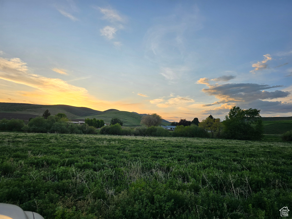 View of mountain backdrop with rural landscape