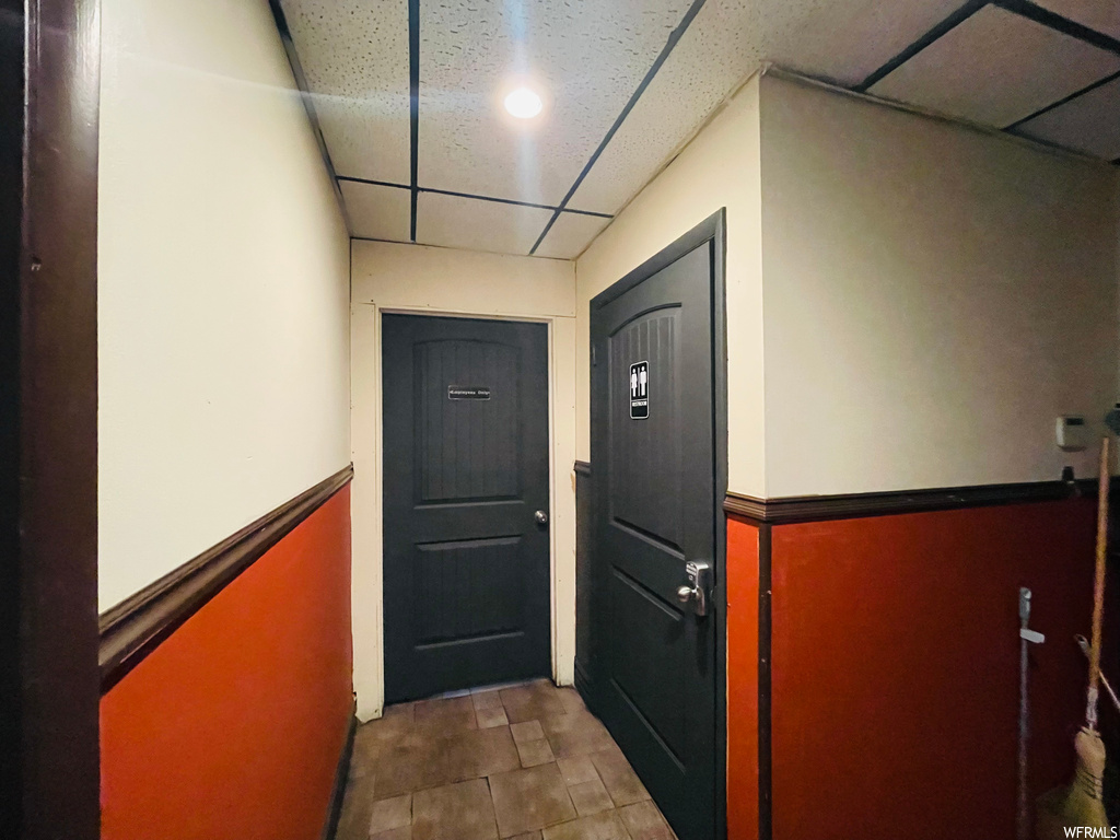 Entryway with tile flooring and a drop ceiling