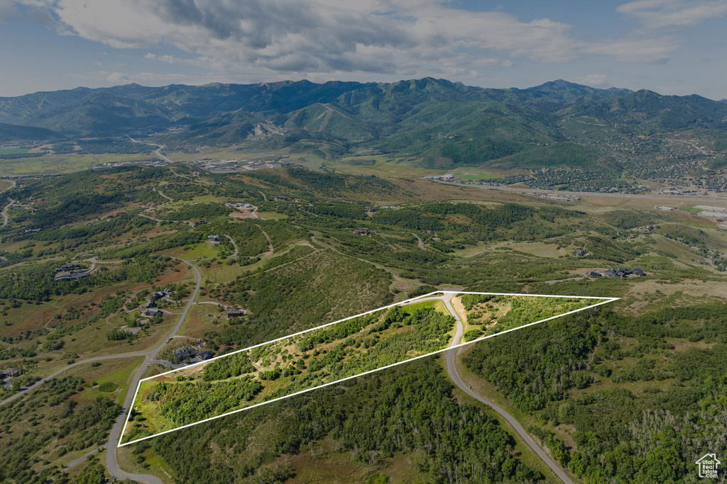 Aerial overview of property's location featuring mountains and property boundaries highlighted