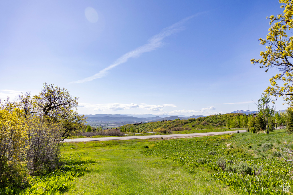 View of mountain backdrop with rural landscape