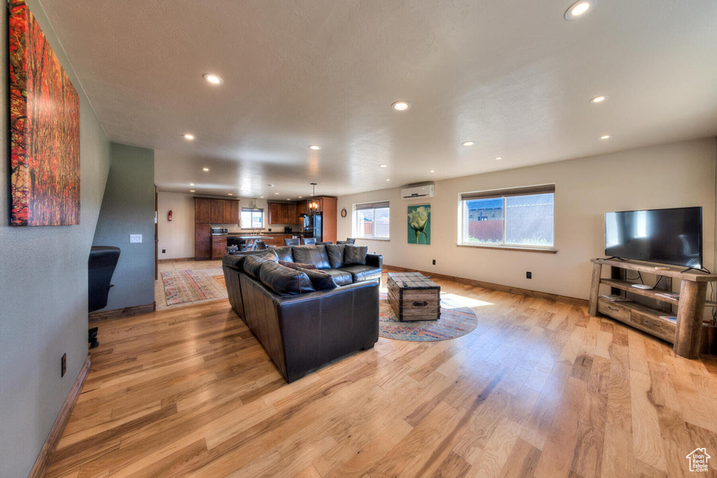 Living room with light hardwood / wood-style floors