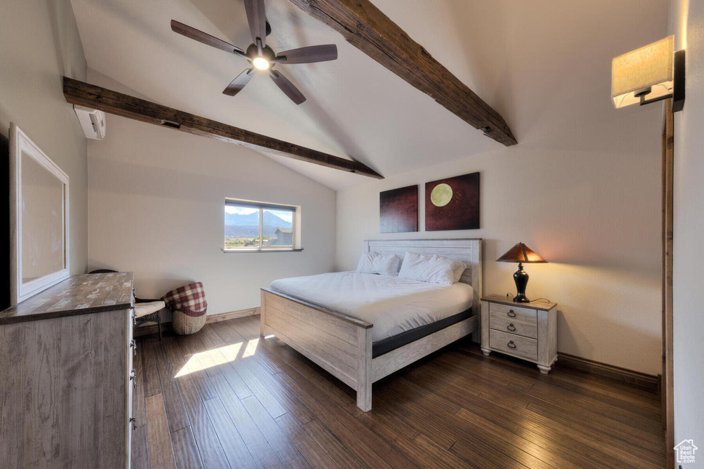 Bedroom with vaulted ceiling with beams, dark hardwood / wood-style floors, and ceiling fan