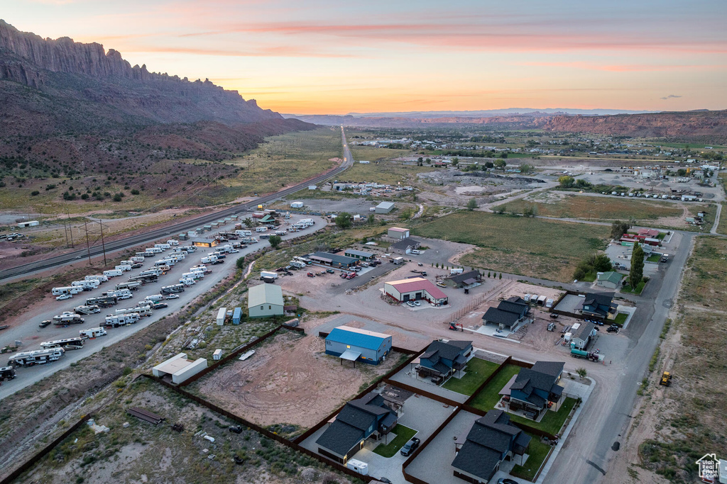 Aerial view at dusk featuring a mountain view