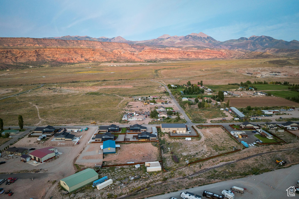 Birds eye view of property with a mountain view