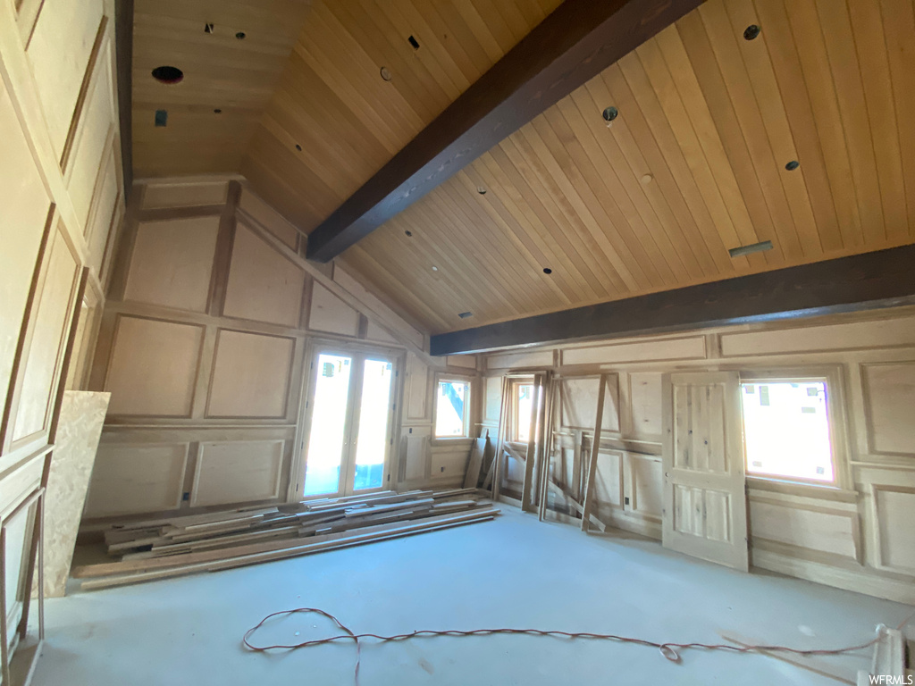 Misc room featuring lofted ceiling with beams and wooden ceiling
