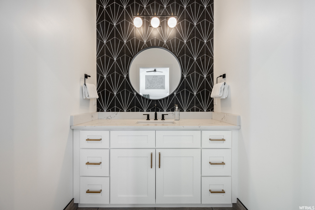 Bathroom with mirror and vanity