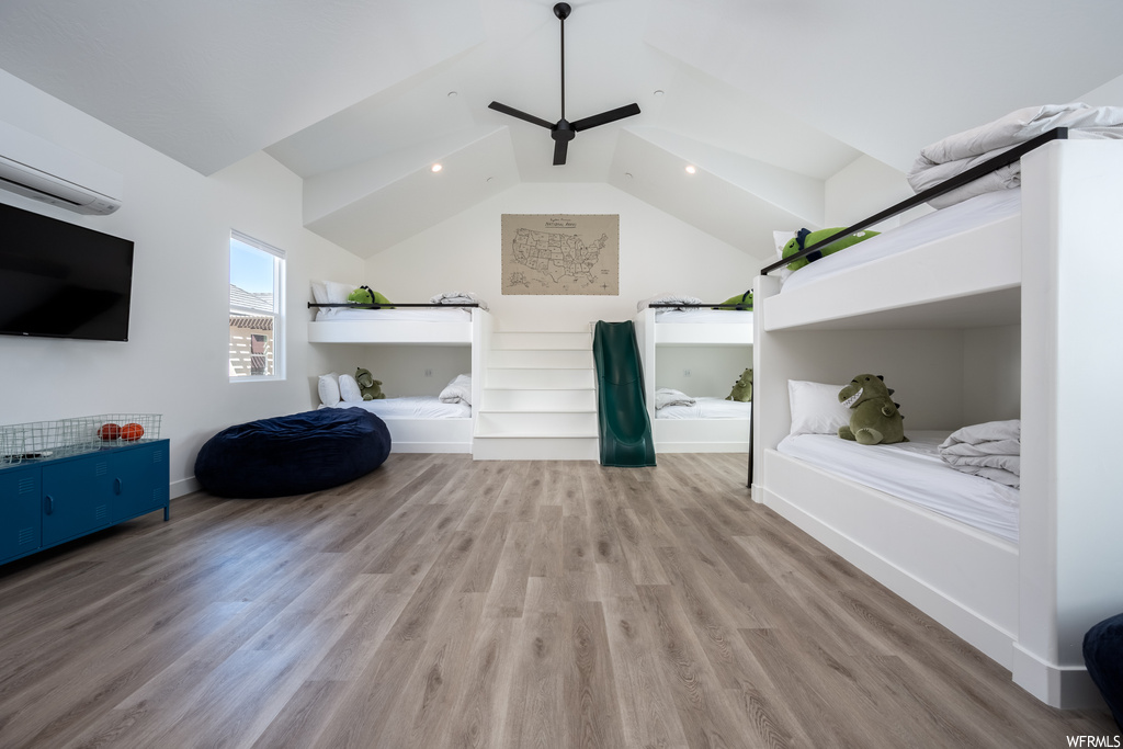 Interior space featuring vaulted ceiling and light hardwood flooring