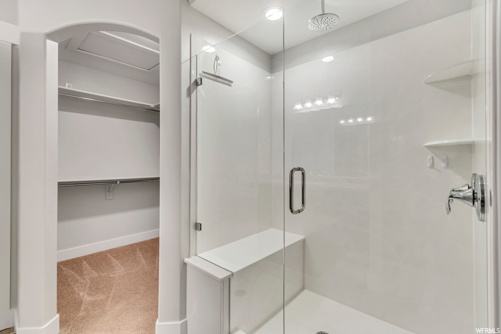 Bathroom featuring a shower with shower door