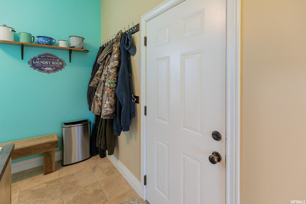 Interior space featuring light tile floors