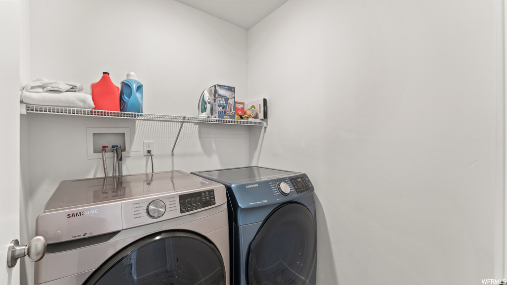 Laundry area featuring washer and clothes dryer