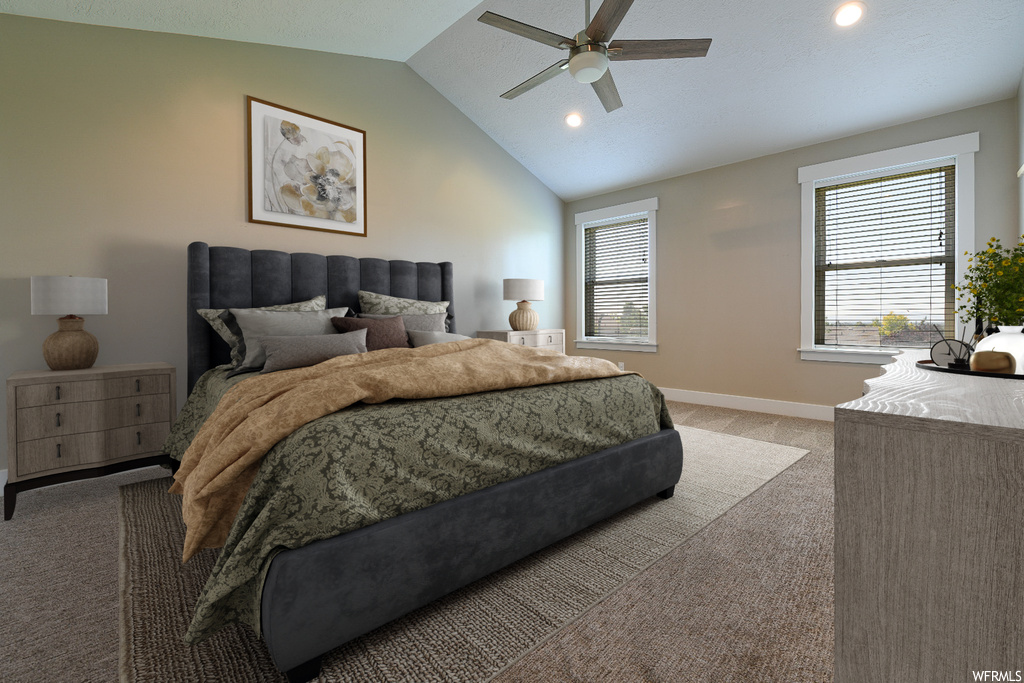 Bedroom featuring carpet, vaulted ceiling, and ceiling fan