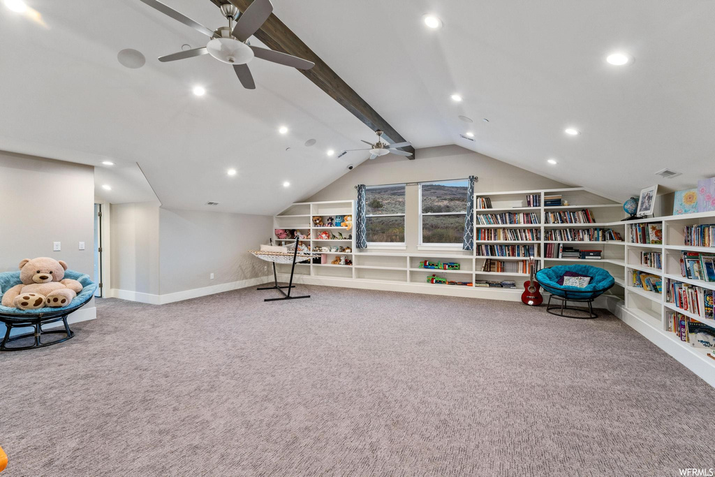 Rec room with lofted ceiling with beams, light carpet, and ceiling fan