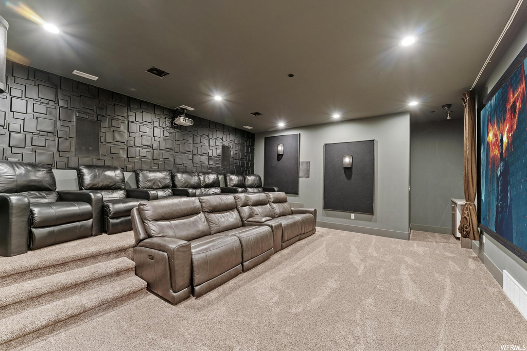 Home theater room with light carpet