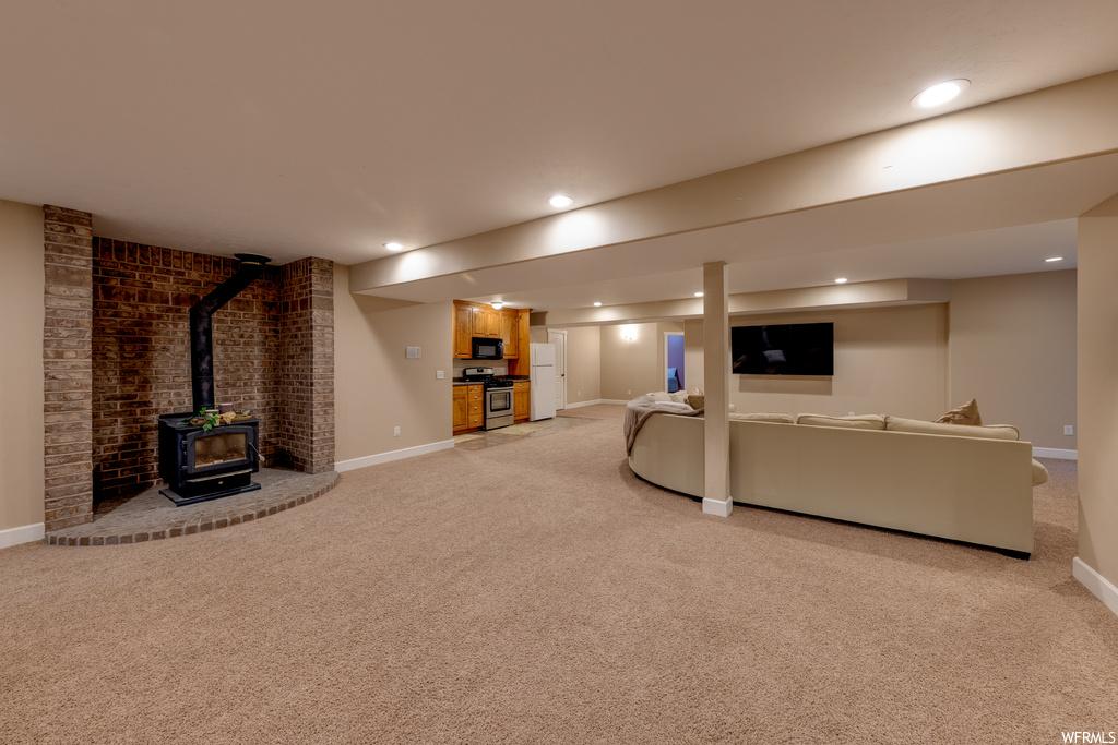Living room with light carpet and a fireplace