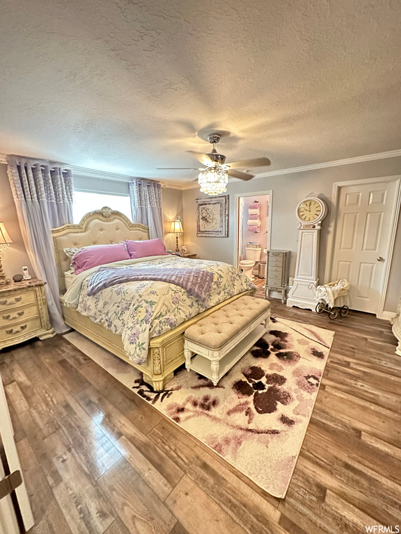 Bedroom featuring light hardwood flooring, ornamental molding, a textured ceiling, and ceiling fan