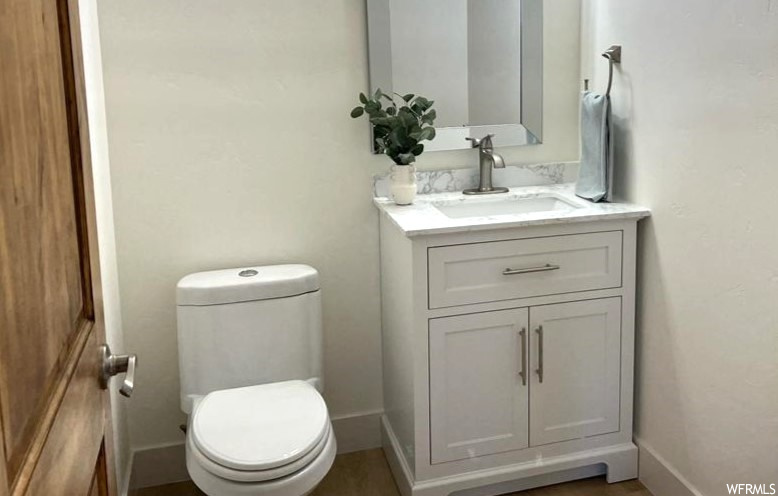Bathroom with mirror and vanity