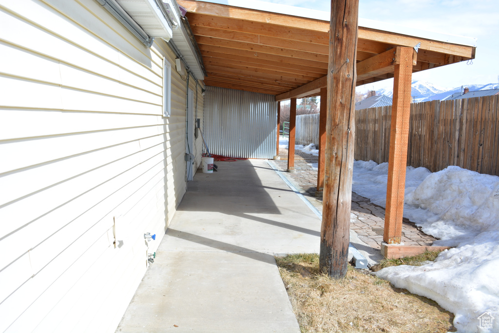 View of patio featuring a carport