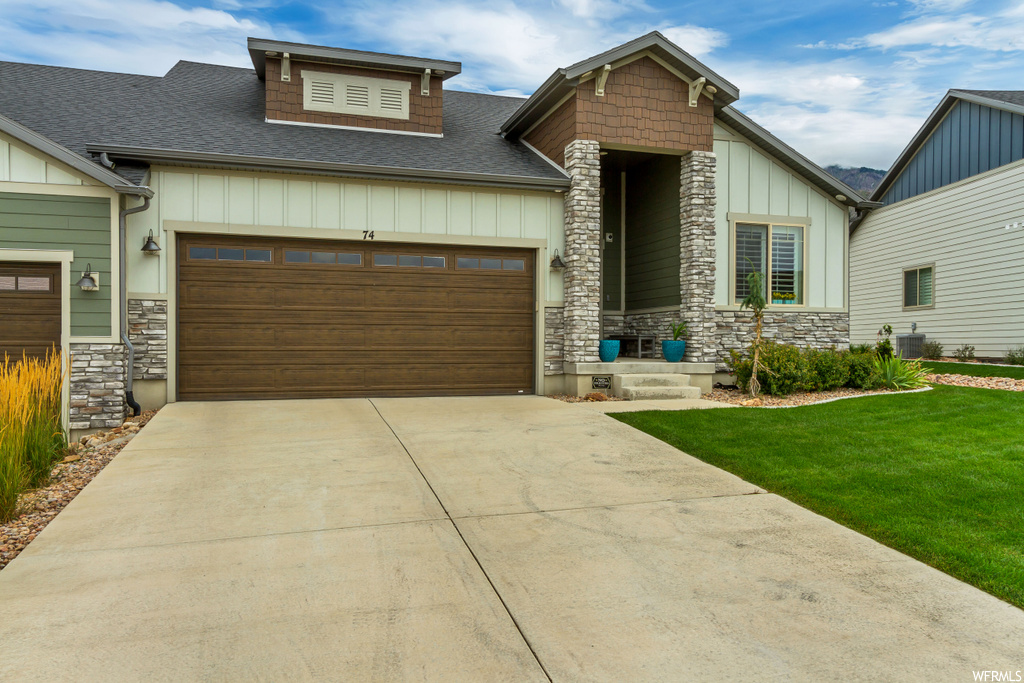 View of front of property with a front lawn
