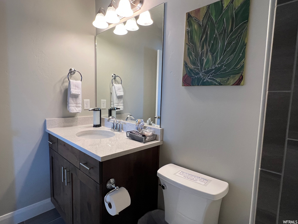 Bathroom featuring mirror and large vanity