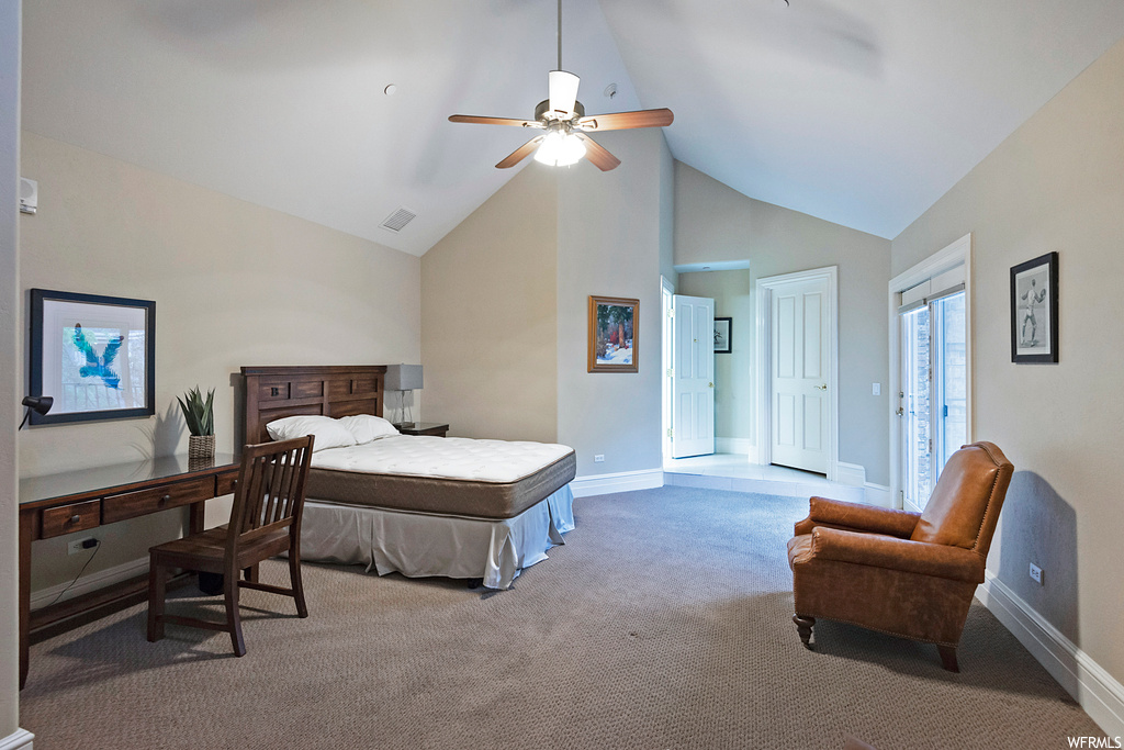 Carpeted bedroom featuring a high ceiling, lofted ceiling, and ceiling fan