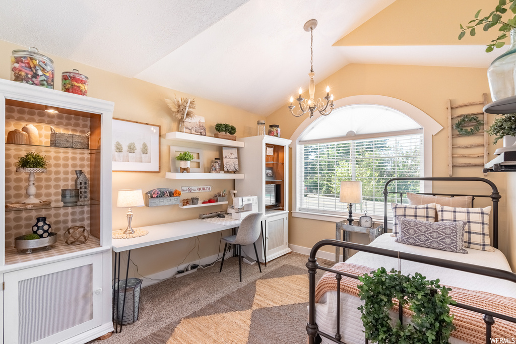Office space with a notable chandelier, light carpet, and vaulted ceiling