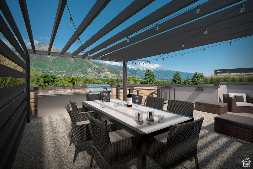 View of patio / terrace with a pergola and a mountain view