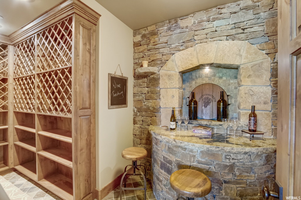 Wine cellar with tile flooring