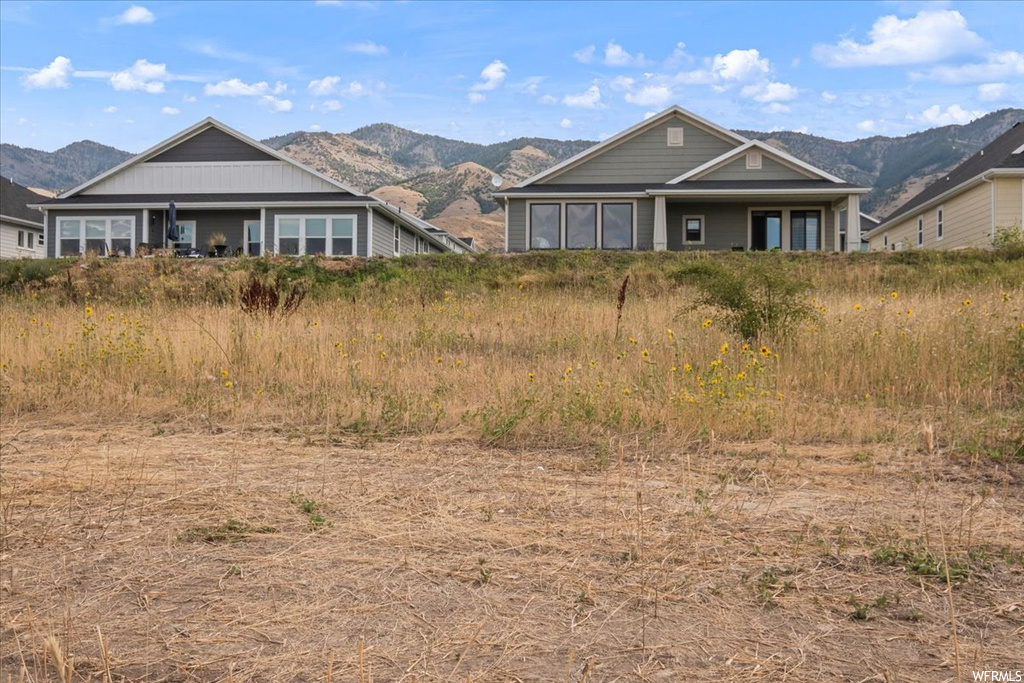 View of front of property with a mountain view