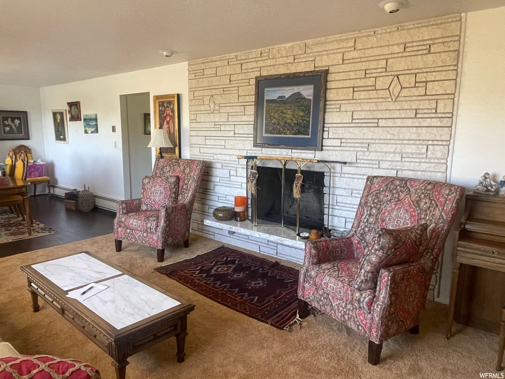 Carpeted living room featuring a fireplace