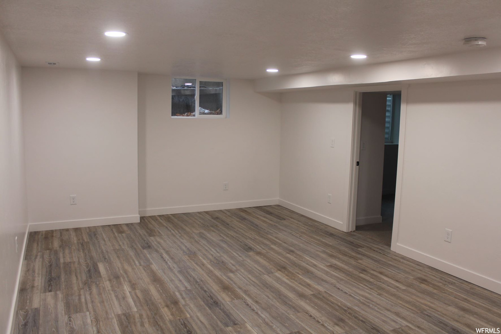 Basement featuring light hardwood flooring