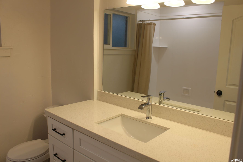 Bathroom with large vanity and mirror
