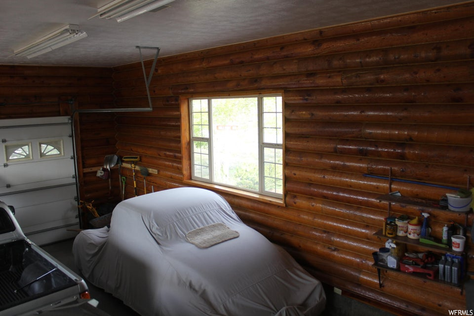 Bedroom with log walls
