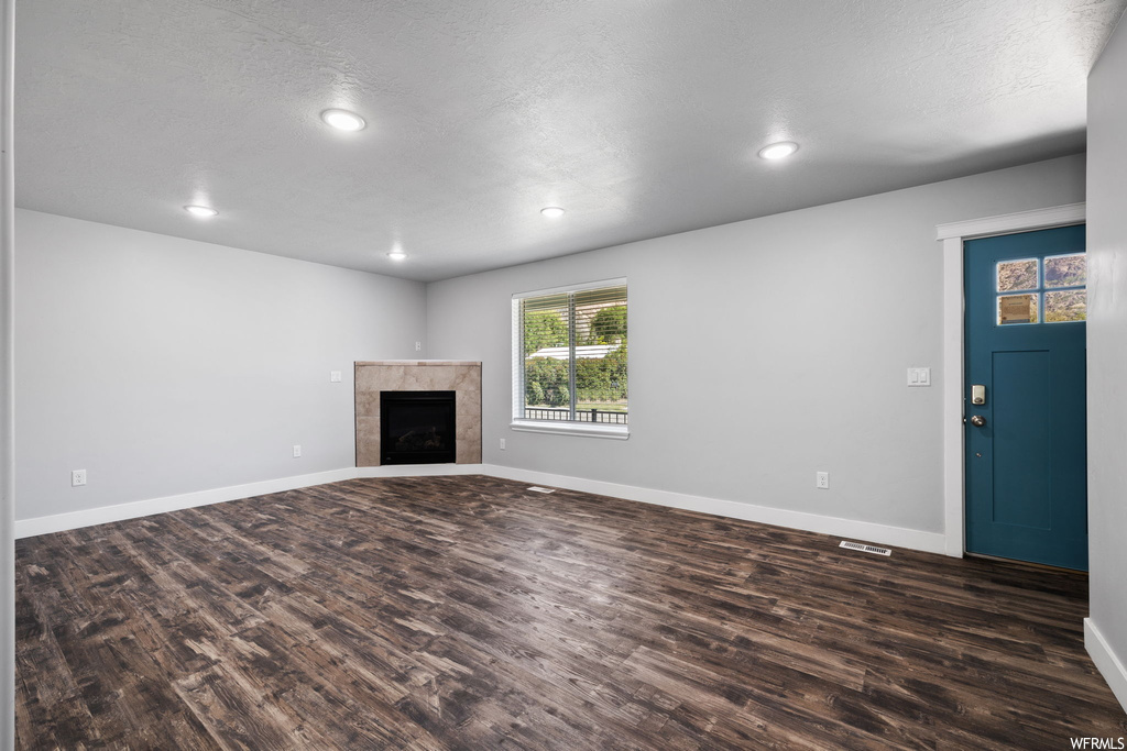 Hardwood floored living room with a fireplace
