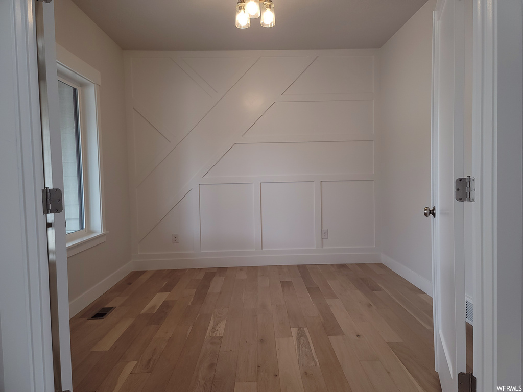 Spare room featuring light hardwood floors