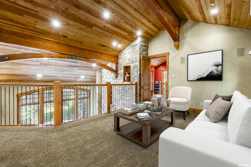 Living room featuring carpet floors, vaulted ceiling with beams, and wooden ceiling