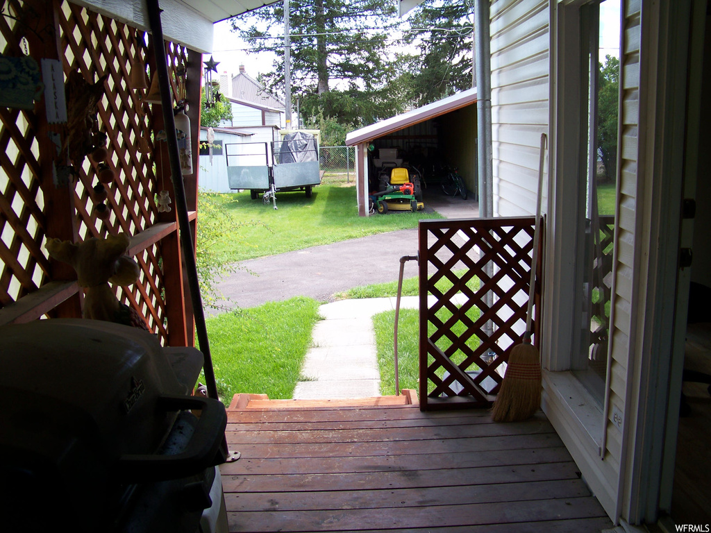 Deck featuring a lawn