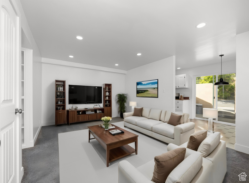 Living room featuring dark carpet