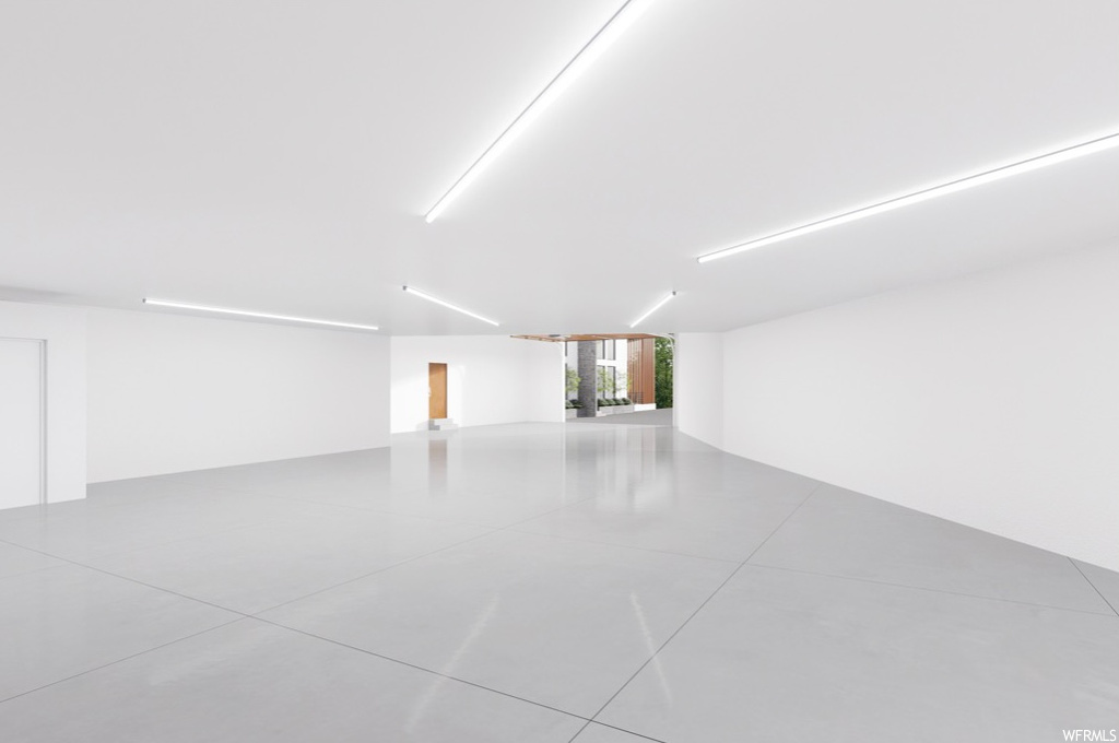 Empty room with light tile floors