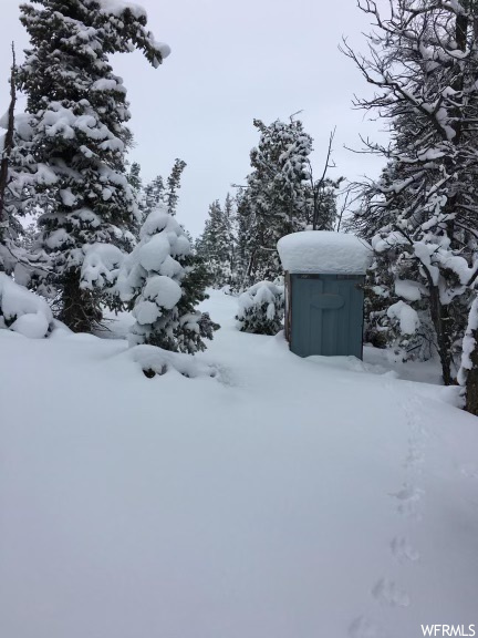 View of yard covered in snow