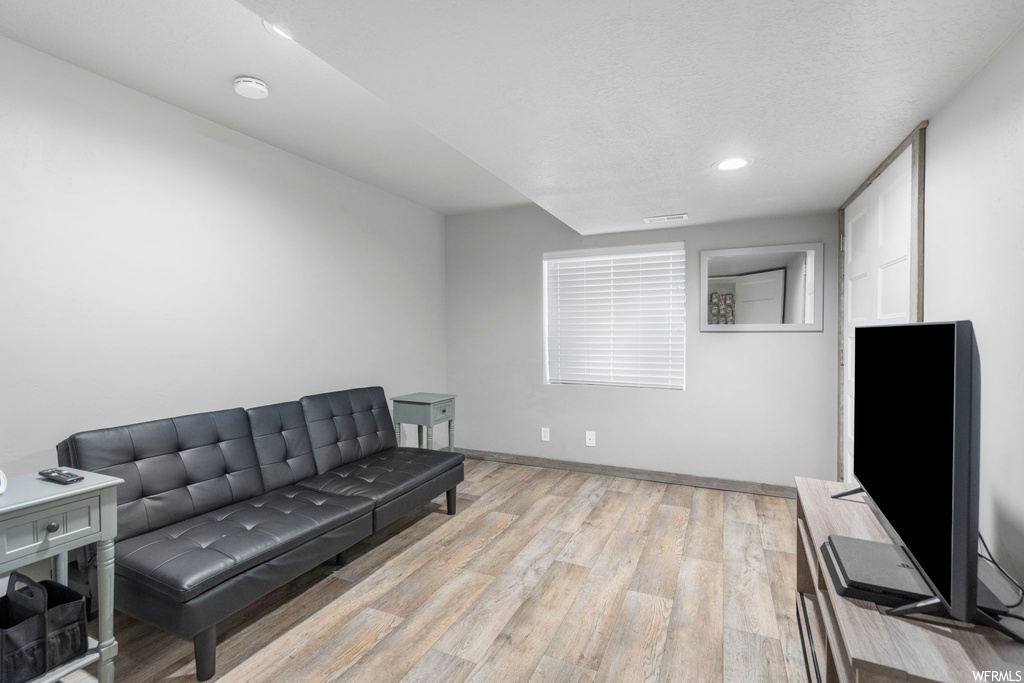 Living area with light hardwood floors