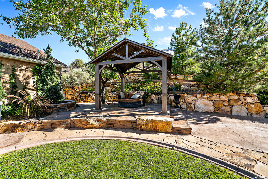 View of yard with a gazebo, an outdoor living space, and a patio area