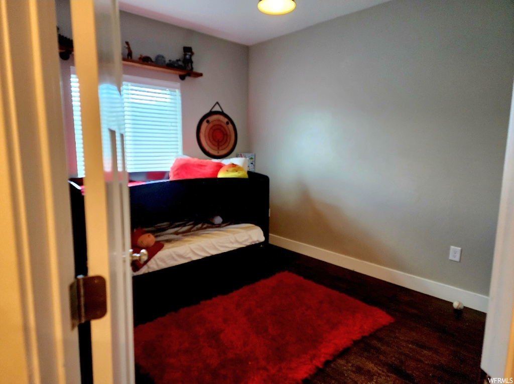 View of hardwood floored bedroom