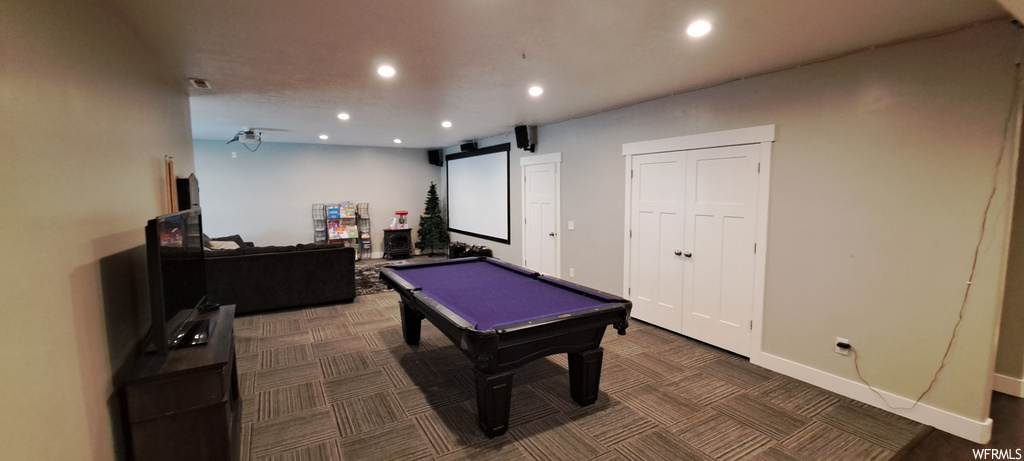 Game room with dark carpet