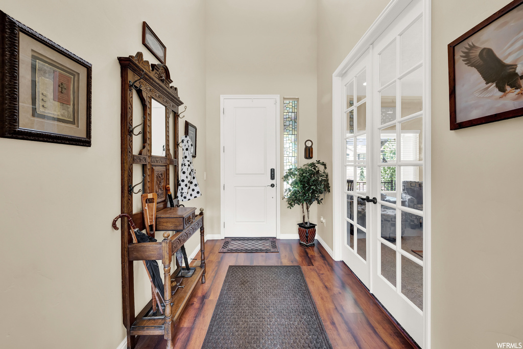 Foyer entrance with hardwood floors and french doors