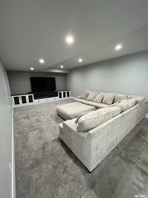Living room featuring concrete flooring