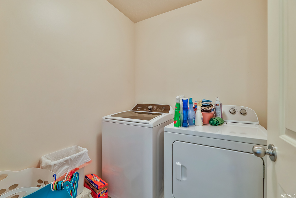 Laundry room featuring separate washer and dryer