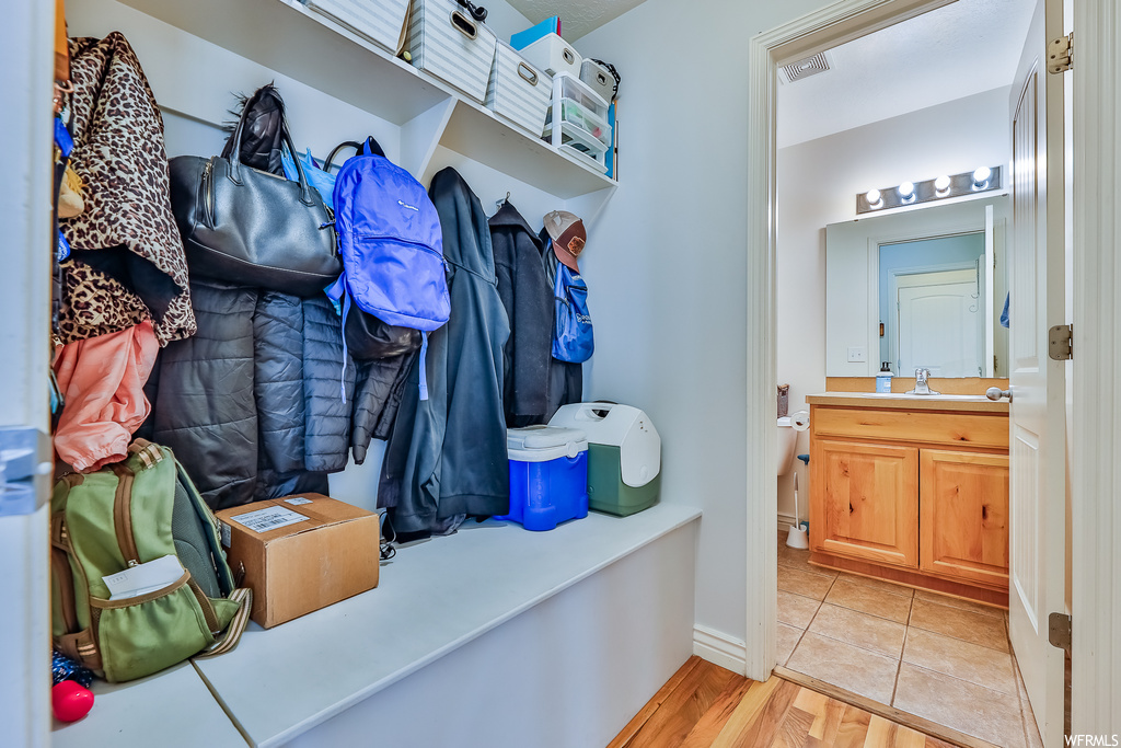 Mudroom featuring light hardwood flooring