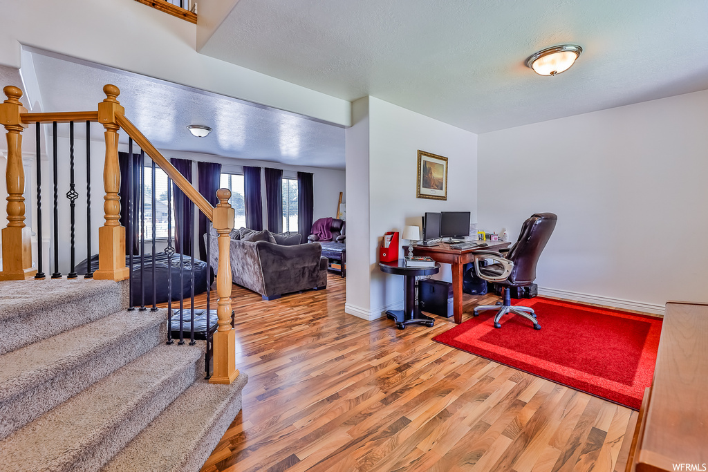 View of hardwood floored home office