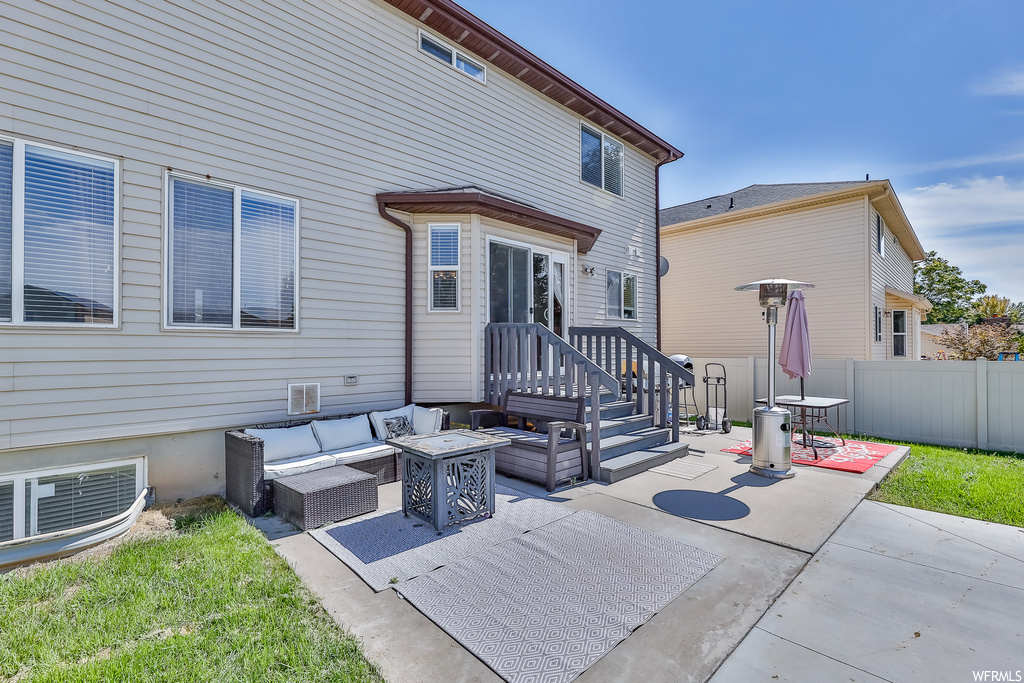 View of terrace featuring an outdoor living space with a fire pit